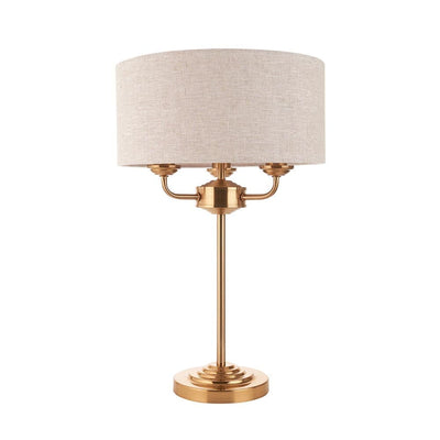 In Stock - Juniper 3 Light Brass Table Lamp with Neutral Shade Lighting 
